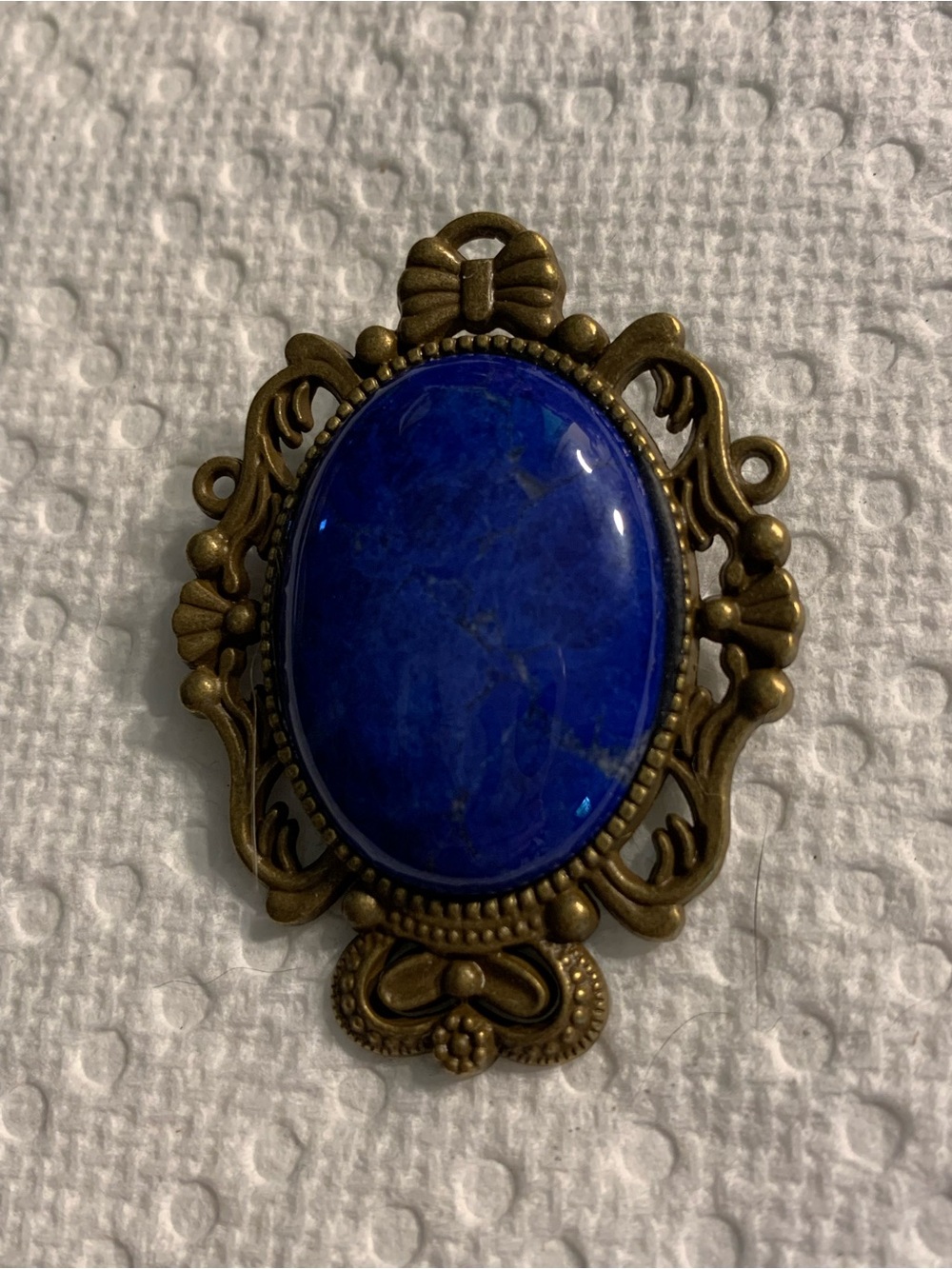 Antique-Style Brass Brooch with Deep Blue Oval Stone